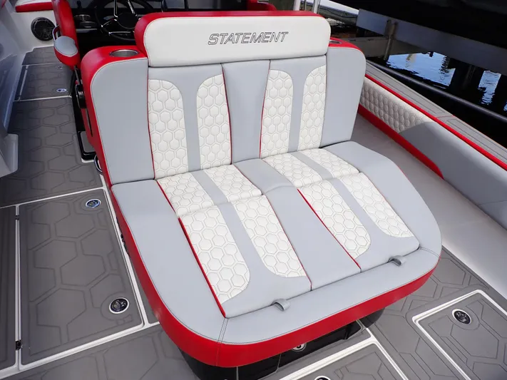  Yacht Photos Pics 2024 Statement 350 Open boat seating with red and white upholstery, featuring hexagonal patterns.