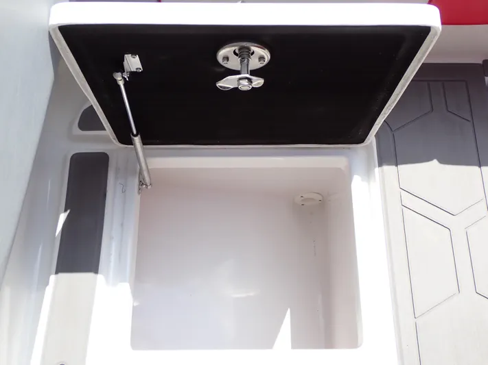  Yacht Photos Pics 2024 Statement 350 Open storage compartment with open lid and hydraulic support.