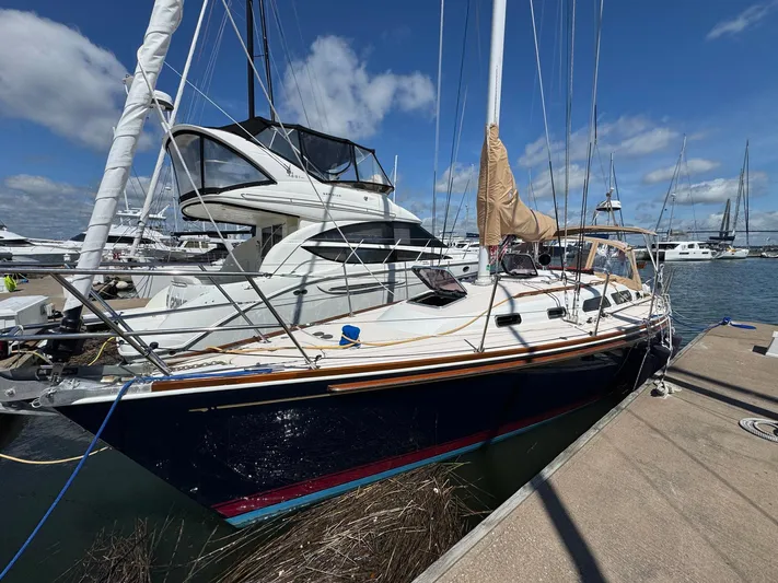 Delta Sand Yacht Photos Pics Sailboat Sabre 362, 2000 model, docked at marina under clear blue sky.