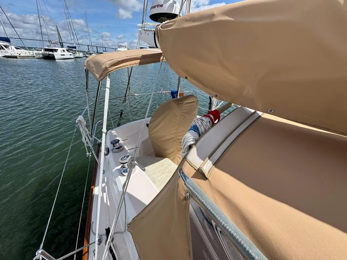 Delta Sand Yacht Photos Pics Sabre 362 sailboat from 2000 docked in marina, featuring tan covers and clear skies.