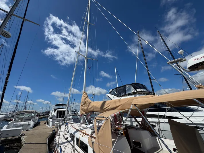 Delta Sand Yacht Photos Pics Sailboat Sabre 362, 2000 model, docked at marina under clear blue sky.