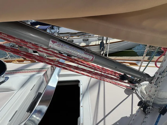 Delta Sand Yacht Photos Pics Sailboat rigging on a 2000 Sabre 362, featuring red ropes and a metal boom.