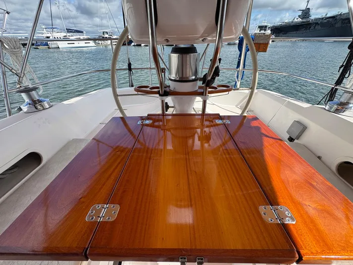 Delta Sand Yacht Photos Pics Cockpit of 2000 Sabre 362 sailboat with polished wooden table, docked in marina.