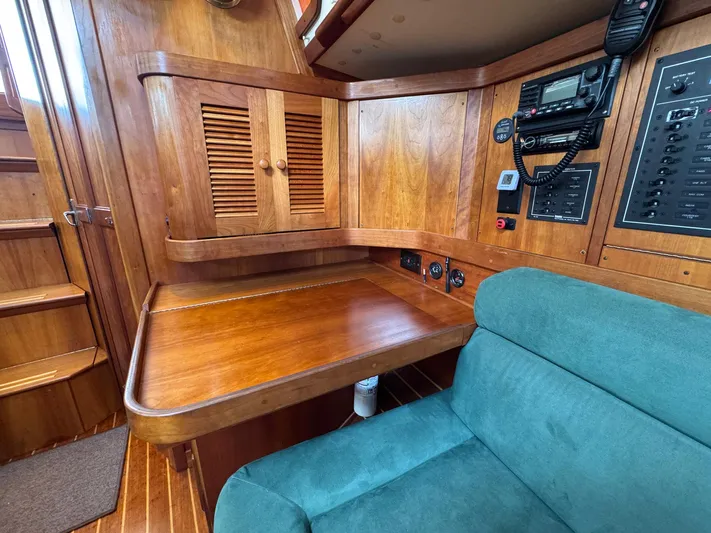 Delta Sand Yacht Photos Pics Interior of 2000 Sabre 362 sailboat with wooden cabinetry and navigation equipment.