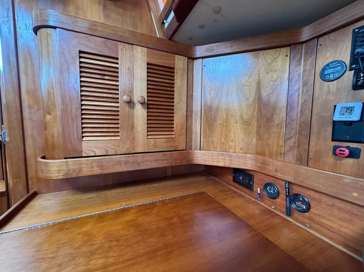 Delta Sand Yacht Photos Pics Interior of 2000 Sabre 362 sailboat with wooden cabinetry and control panel.