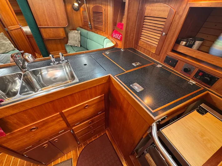 Delta Sand Yacht Photos Pics Interior of 2000 Sabre 362 sailboat galley with wood cabinetry and dual sink.