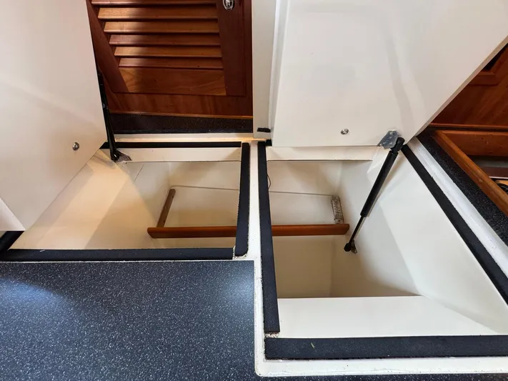 Delta Sand Yacht Photos Pics Interior storage compartments of a 2000 Sabre 362 yacht, featuring wooden accents and sleek design.