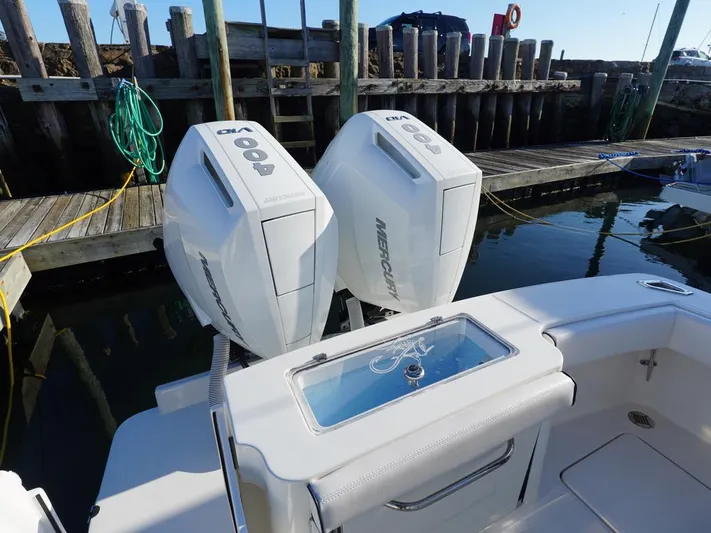  Yacht Photos Pics 2024 Albemarle 30 Express boat with twin Mercury outboard engines at dock.