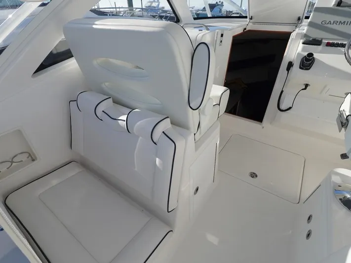  Yacht Photos Pics 2024 Albemarle 30 Express boat interior with white seating and modern controls.