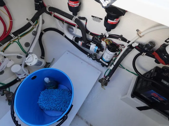  Yacht Photos Pics 2024 Albemarle 30 Express engine compartment with wiring, filters, and maintenance tools.