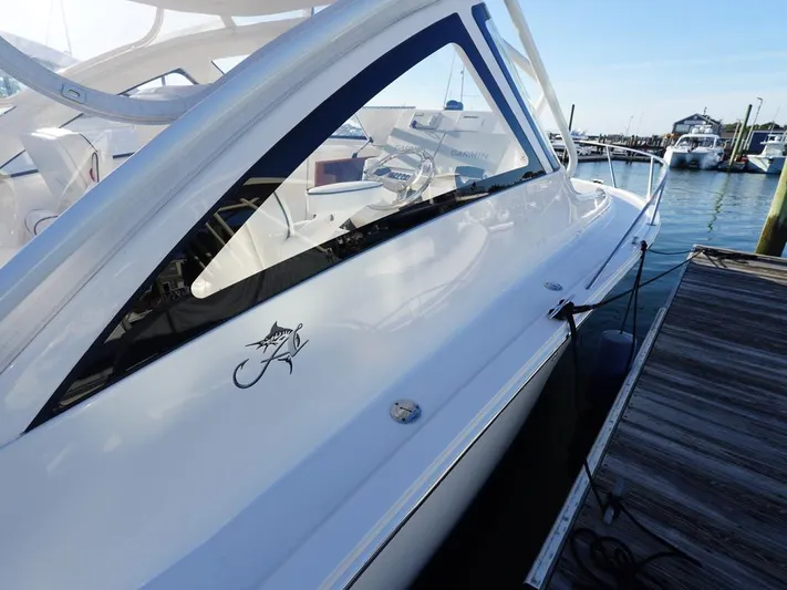  Yacht Photos Pics 2024 Albemarle 30 Express boat docked at marina, sleek design, white exterior.