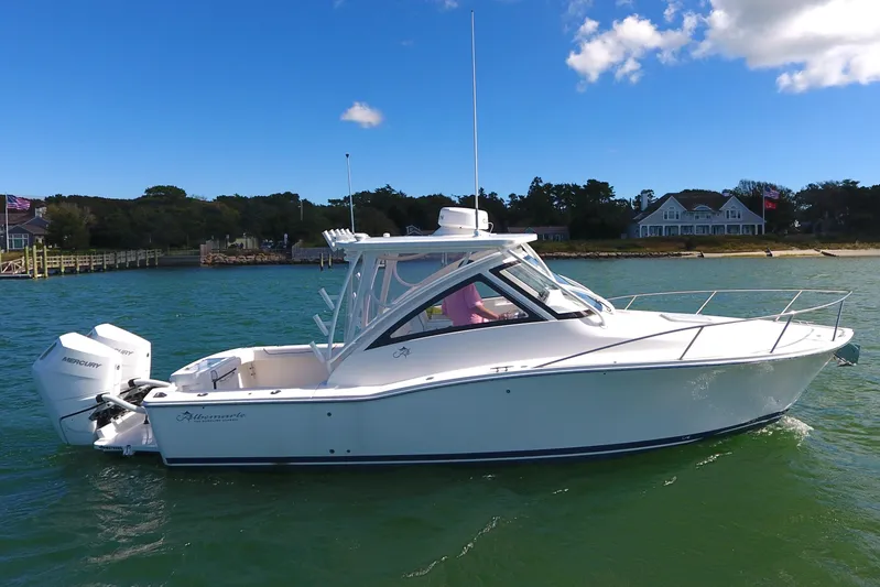  Yacht Photos Pics 2024 Albemarle 30 Express boat on calm water, clear sky background.