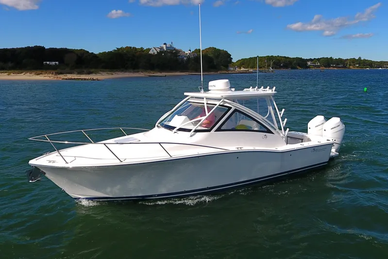  Yacht Photos Pics 2024 Albemarle 30 Express boat cruising on a sunny day in open water.