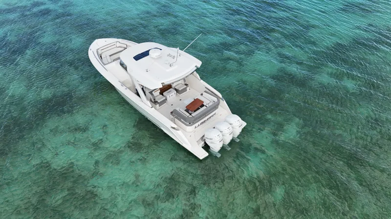  Yacht Photos Pics 2020 Tiara Yachts 38 LS on clear turquoise water, aerial view.