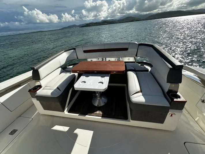  Yacht Photos Pics Luxurious seating area on 2020 Tiara Yachts 38 LS, overlooking serene ocean waters.