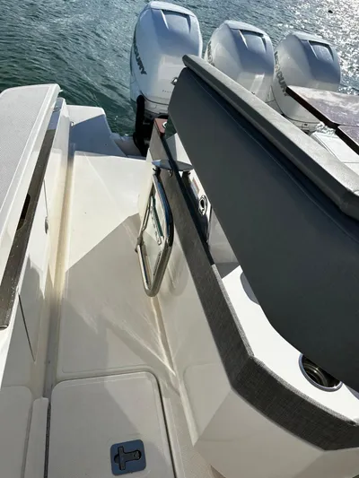  Yacht Photos Pics 2020 Tiara Yachts 38 LS boat with triple outboard engines on water.