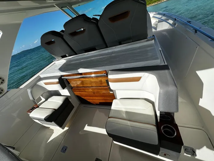  Yacht Photos Pics Luxurious 2020 Tiara Yachts 38 LS interior with sleek seating and ocean view.