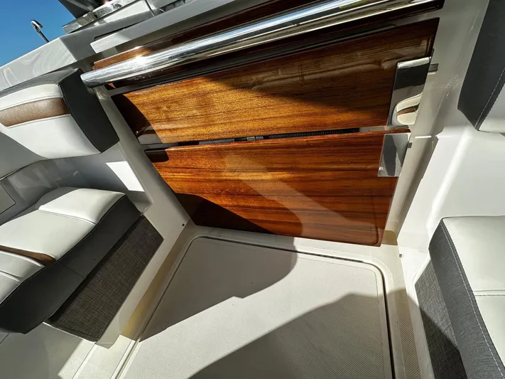  Yacht Photos Pics 2020 Tiara Yachts 38 LS interior with sleek wood finish and modern seating.