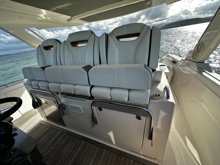  Yacht Photos Pics Luxurious seating on 2020 Tiara Yachts 38 LS, overlooking serene ocean waters.
