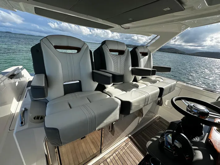  Yacht Photos Pics Luxurious seating on 2020 Tiara Yachts 38 LS, overlooking serene ocean waters.