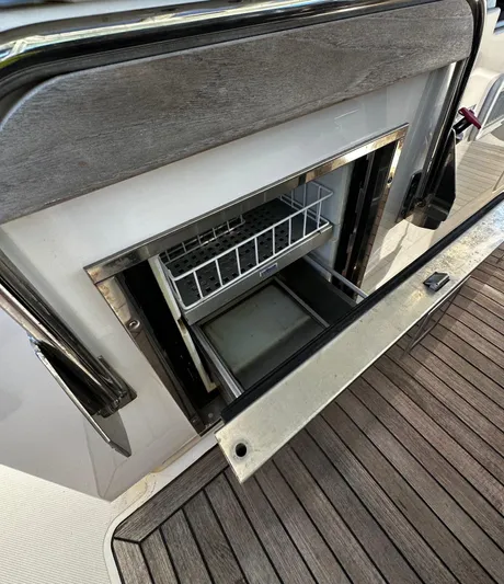  Yacht Photos Pics 2020 Tiara Yachts 38 LS, open storage compartment with wooden flooring.