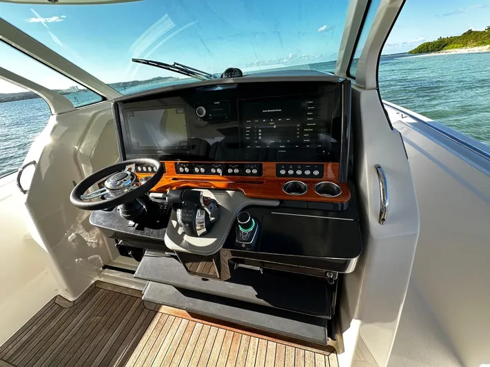  Yacht Photos Pics Cockpit of 2020 Tiara Yachts 38 LS with modern controls and scenic ocean view.