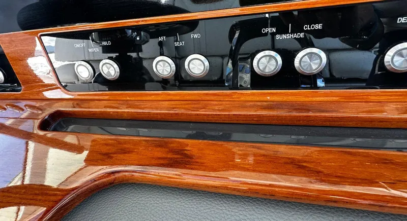  Yacht Photos Pics Control panel of 2020 Tiara Yachts 38 LS with wood finish and labeled buttons.