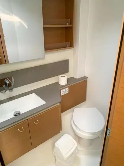  Yacht Photos Pics Modern bathroom in 2023 Excess 15 yacht with sink, toilet, and storage cabinets.