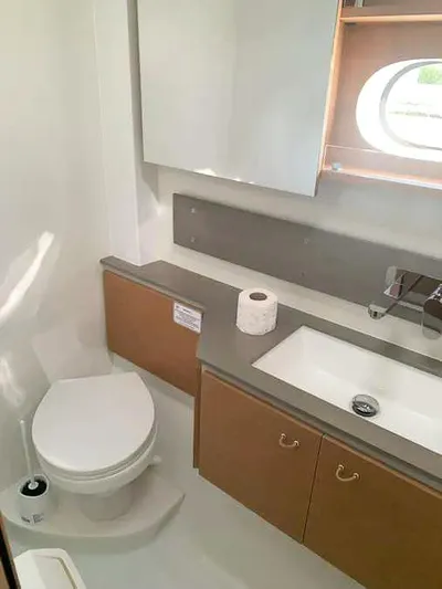  Yacht Photos Pics Modern bathroom in 2023 Excess 15 yacht with toilet, sink, and storage.