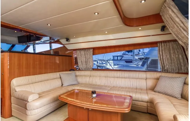  Yacht Photos Pics Luxurious interior of a 2005 Johnson 70 yacht with plush seating and elegant decor.