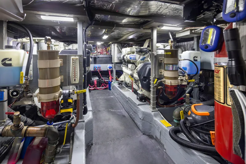 Graceful Spirit Yacht Photos Pics Engine room of 1990 Tollycraft 44 Cockpit Motor Yacht, featuring mechanical components and equipment.