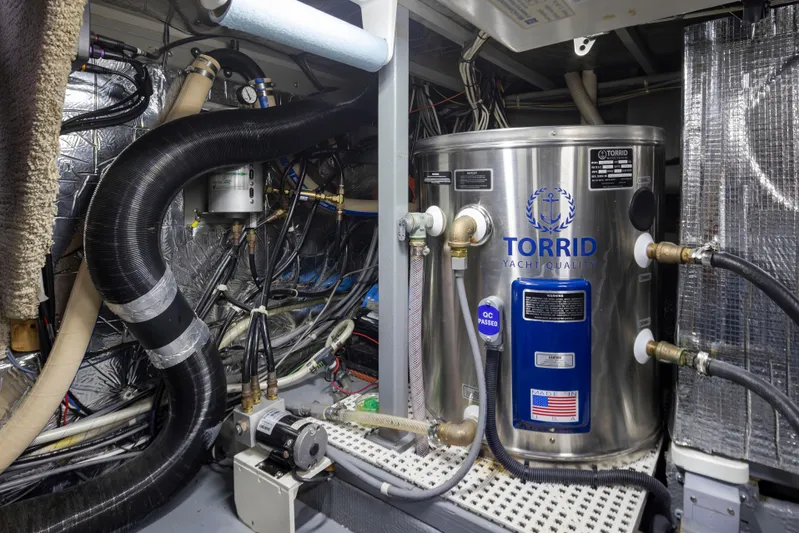 Graceful Spirit Yacht Photos Pics Engine room of 1990 Tollycraft 44 Cockpit Motor Yacht with Torrid water heater.