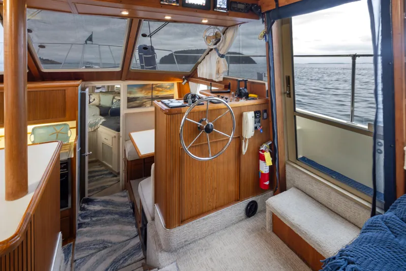 Graceful Spirit Yacht Photos Pics Interior of 1990 Tollycraft 44 Cockpit Motor Yacht with helm and cabin view.