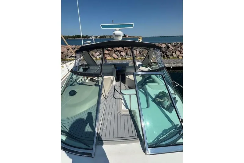  Yacht Photos Pics 2001 Cruisers Yachts 3870 boat docked, featuring sleek design and spacious deck area.