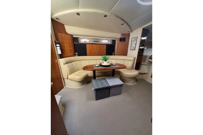  Yacht Photos Pics Interior of 2001 Cruisers Yachts 3870 with beige seating and wooden accents.