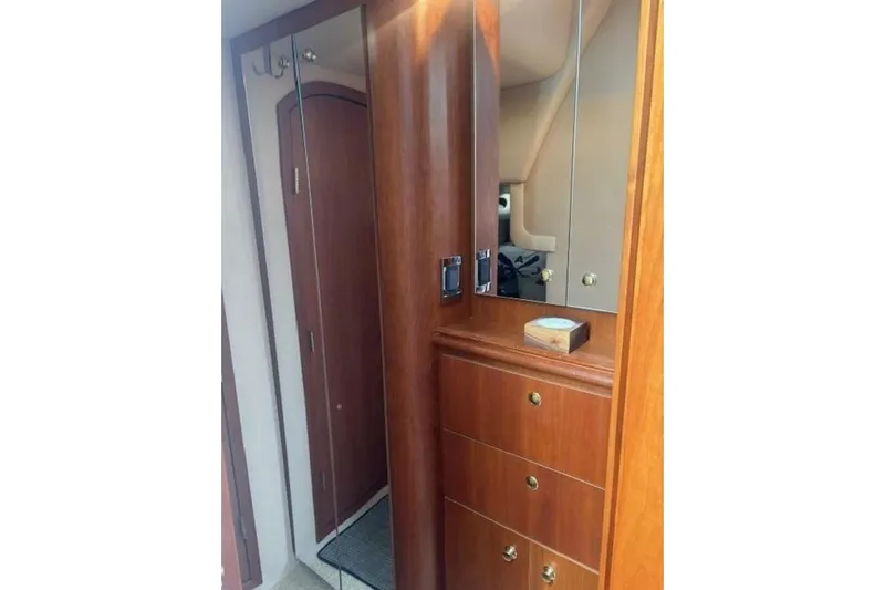  Yacht Photos Pics Interior of 2001 Cruisers Yachts 3870 featuring wooden cabinetry and mirrored surfaces.