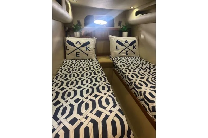  Yacht Photos Pics Twin beds in 2001 Cruisers Yachts 3870 cabin with geometric bedding and decorative pillows.