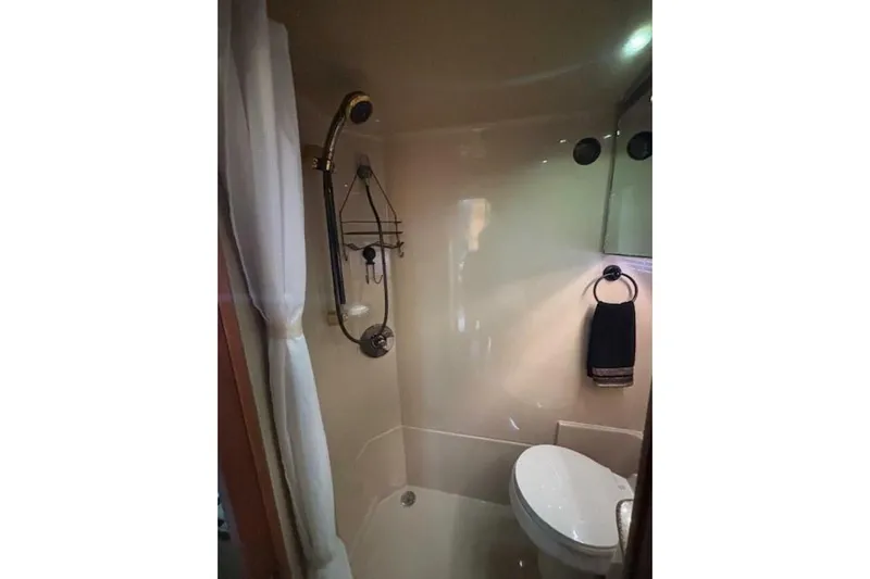  Yacht Photos Pics Bathroom interior of 2001 Cruisers Yachts 3870 with shower and toilet.