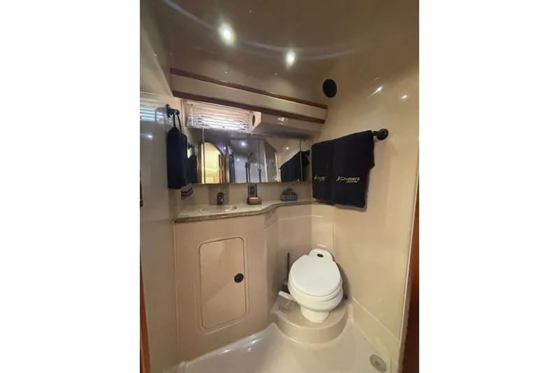  Yacht Photos Pics Bathroom interior of 2001 Cruisers Yachts 3870, featuring sink and toilet.