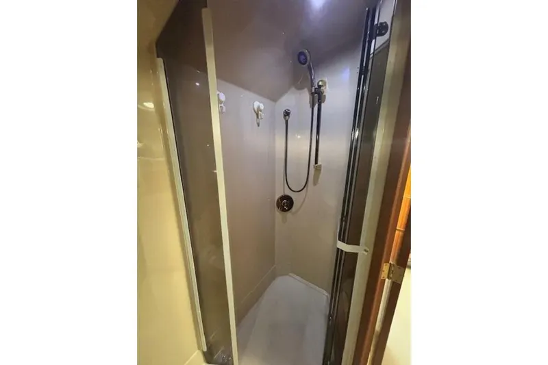  Yacht Photos Pics Shower area in 2001 Cruisers Yachts 3870, featuring modern fixtures and enclosed design.