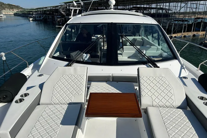 2021 Cruisers Yachts 50 Cantius Yacht Photos Pics 2021 Cruisers Yachts 50 Cantius with luxurious seating and table on deck.
