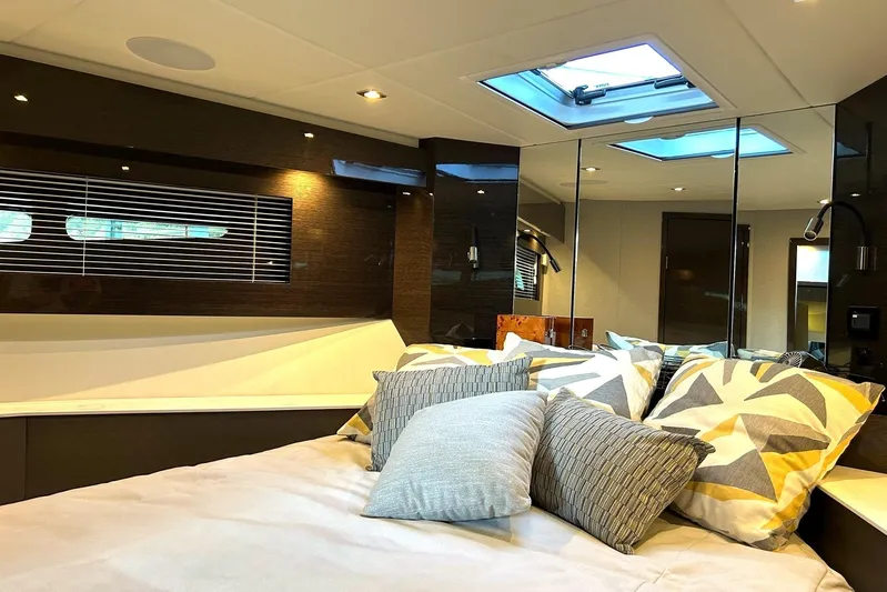 2021 Cruisers Yachts 50 Cantius Yacht Photos Pics Luxurious interior cabin of 2021 Cruisers Yachts 50 Cantius with stylish bedding and skylight.