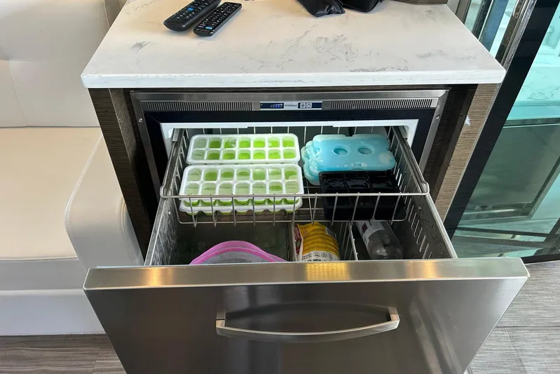 2021 Cruisers Yachts 50 Cantius Yacht Photos Pics Drawer-style freezer in 2021 Cruisers Yachts 50 Cantius, stocked with ice trays and beverages.