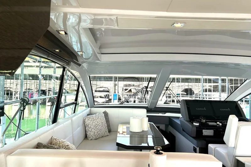 2021 Cruisers Yachts 50 Cantius Yacht Photos Pics Luxurious interior of 2021 Cruisers Yachts 50 Cantius with modern seating and helm.