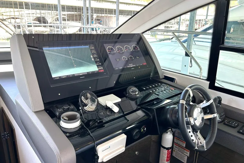 2021 Cruisers Yachts 50 Cantius Yacht Photos Pics Helm of 2021 Cruisers Yachts 50 Cantius with advanced navigation displays and controls.