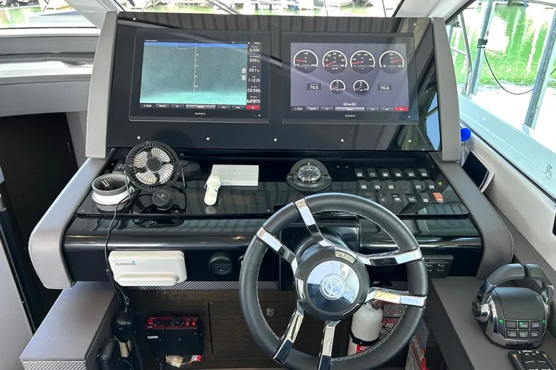 2021 Cruisers Yachts 50 Cantius Yacht Photos Pics Helm of 2021 Cruisers Yachts 50 Cantius with dual displays and modern controls.
