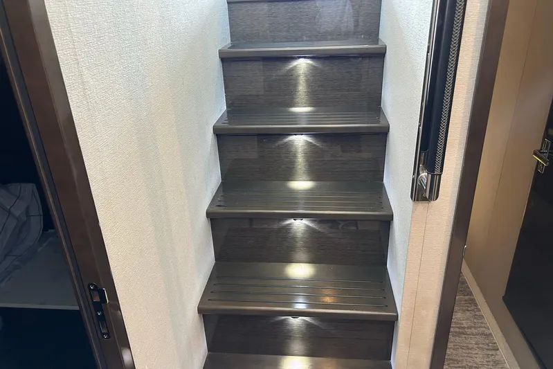 2021 Cruisers Yachts 50 Cantius Yacht Photos Pics Staircase with ambient lighting inside 2021 Cruisers Yachts 50 Cantius.