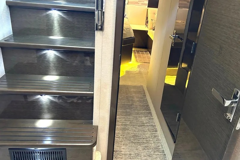 2021 Cruisers Yachts 50 Cantius Yacht Photos Pics Interior of 2021 Cruisers Yachts 50 Cantius, featuring illuminated stairs and modern design.