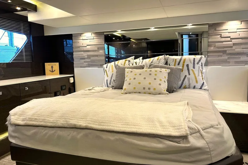 2021 Cruisers Yachts 50 Cantius Yacht Photos Pics Luxurious bedroom interior of 2021 Cruisers Yachts 50 Cantius with modern decor.