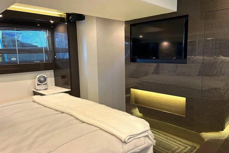 2021 Cruisers Yachts 50 Cantius Yacht Photos Pics Luxurious bedroom interior of 2021 Cruisers Yachts 50 Cantius with modern decor and TV.